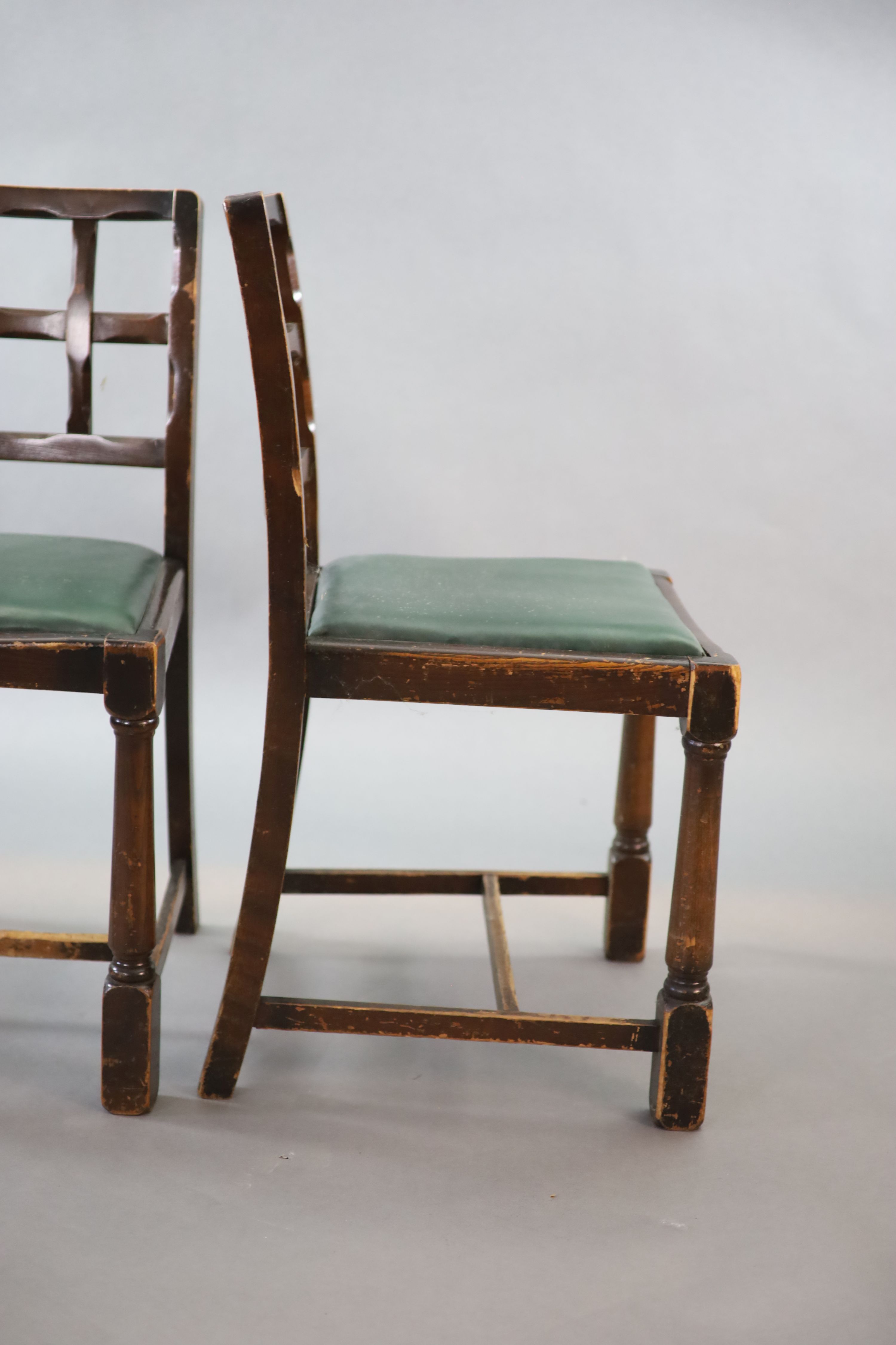 A set of ten early 20th century oak and beech dining chairs